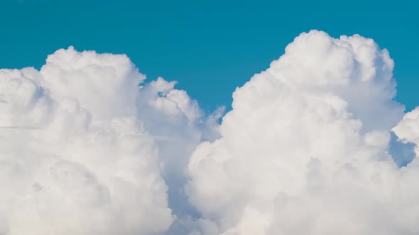 Timelapse of White Puffy Cumulus Clouds Forming on Summer Blue Sky