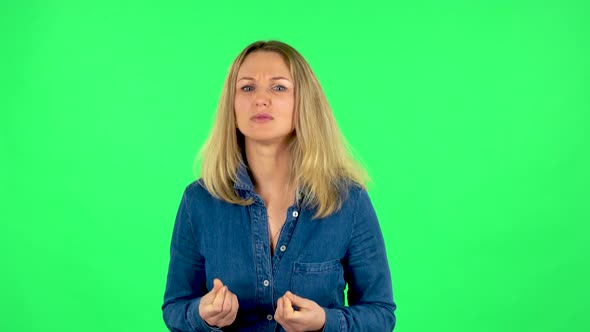 Portrait of Fair Woman Is Looking at Camera with Anticipation, Then Very Upset. Green Screen