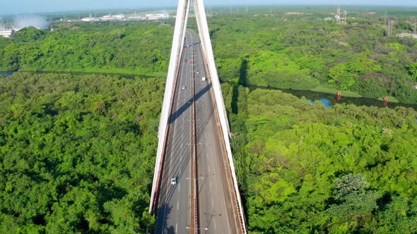 Aerial tilt-up descending over Mauricio Baez bridge in Dominican Republic