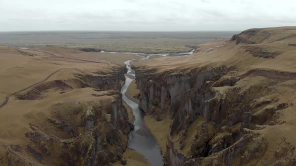 Cinematic aerial flyover of stunning Icelandic canyon.