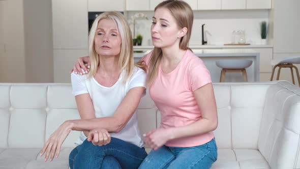 Caring Grownup Daughter Provides Emotional Support to Depressed Senior Mother Sharing Problems