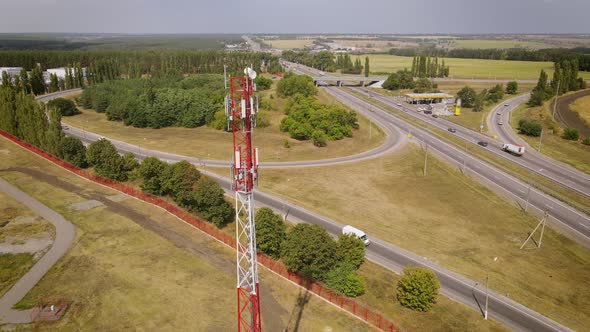 Cell Site of Telephone Tower with 5G Transceiver By Highway Intersection