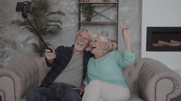 Happy Funny Mature Senior Couple Taking Selfie Looking at Smartphone, Cheerful Elder Old