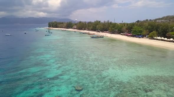 Gili Trawangan beach is a Paradise dreamFantastic aerial view flight panorama curve flight drone fo