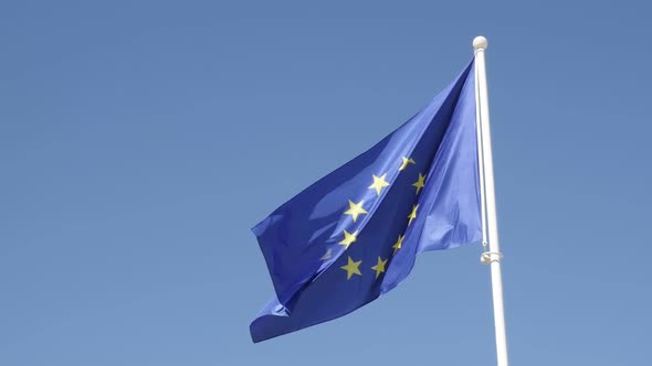 Symbol of EU with yellow stars on blue fabric against sky slow-mo 1920X1080 HD footage - Slow motion