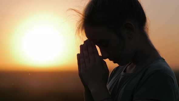 Child Praying at Sunset Thank God