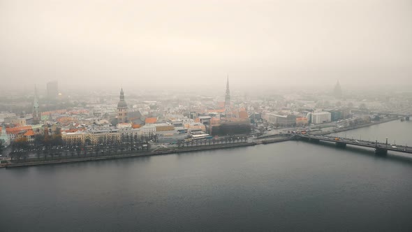 Beautiful Aerial Cityscape View of Riga Old Town and Bridge Over the River Daugava Under Thick Fog
