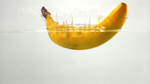 Super Slow Motion One Ripe Banana Falls Under the Water
