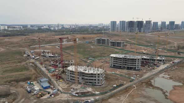 Flight Over The Construction Site. Construction Of Multi Storey Buildings.