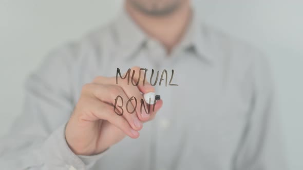 Mutual Bonds Writing on Screen with Hand