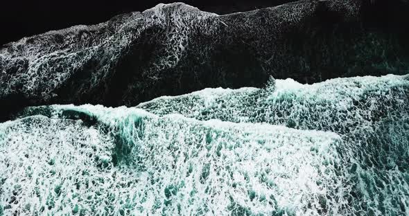 Aerial and top view of black beach with waves in tenerife