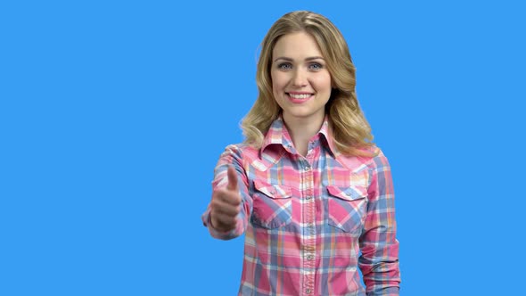 Young Beautiful Woman Giving Thumb Up on Blue Background