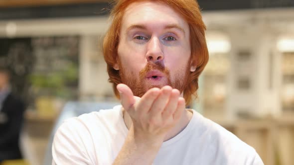 Flying Kiss Gesture By Redhead Beard Man Fell in Love