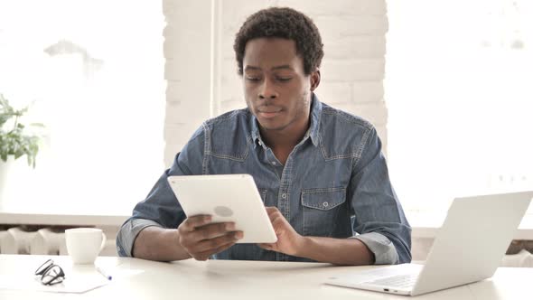 African Man Using Tablet