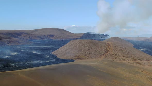 Erupting volcano surrounded with lava fields near Grindavik in Iceland