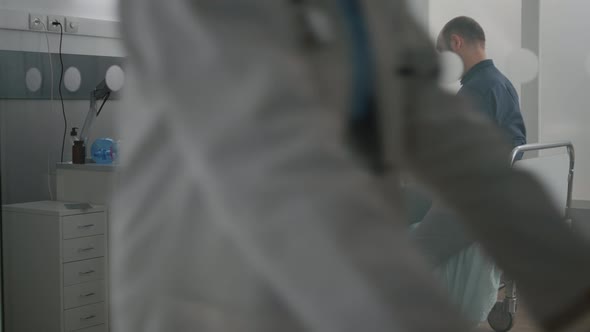 African American Pediatrician Nurse Discussing Sickness Symptoms with Sick Little Child