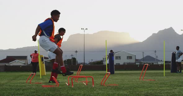 Young adult female rugby team training