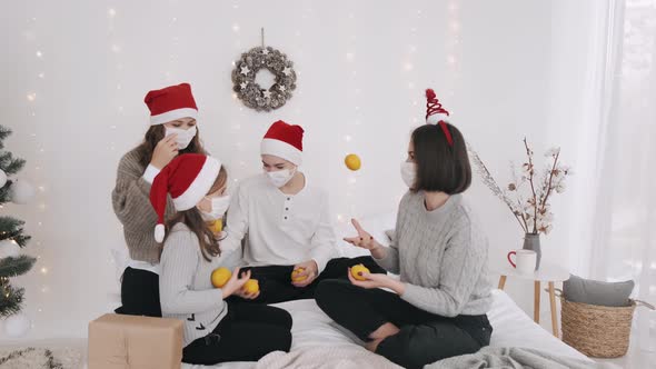 Festive Family in Party Hats and Masks Celebrating New Year