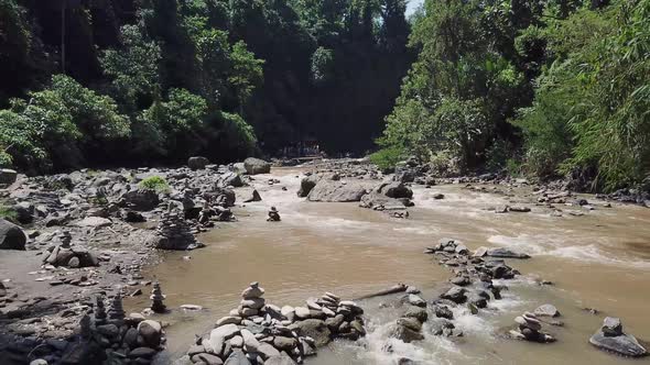 Flying over the mountain river. Around the tropical jungle  and rocks.