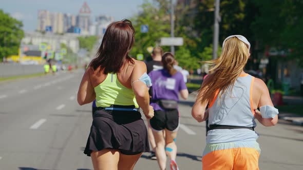 Body Positive Women Running Marathon in Slow Motion