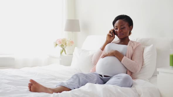 Happy Pregnant Woman Calling on Smartphone at Home 23