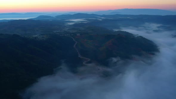 4K Aerial view of Mountains landscape with morning fog.