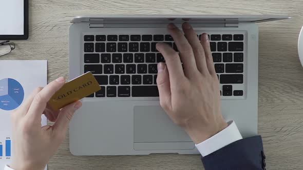 Man Typing Number of Gold Card on Laptop, Online Banking and Payment, Vip Client