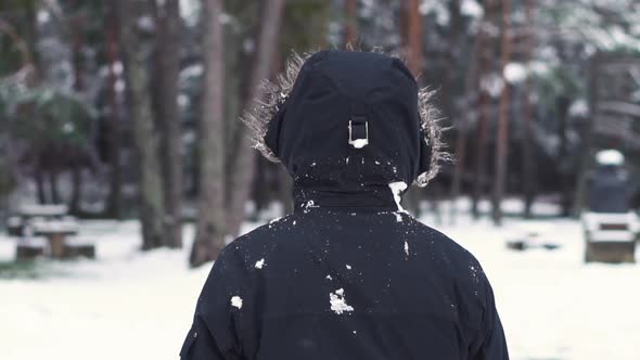 Unrecognizable Person Hit By Snowball in Slow Motion. Snowball Fight. Winter Fun, Active Leisure.