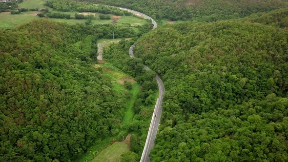 Aerial View Of Countryside Road Passing Through The Mountain Landscape