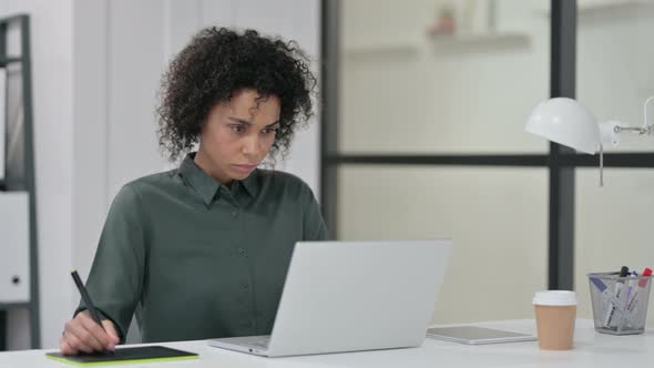 African Woman Using Graphic Tablet Laptop