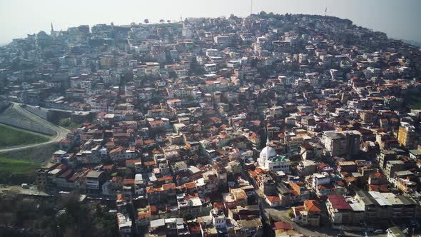 Drone view on poverty slum district and muslim mosque