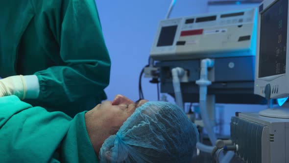 asian coworker Medical Team Performing Surgical Operation in Operating Room