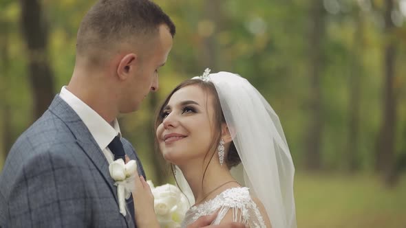 Caucasian Groom with Bride in the Park. Wedding Couple. Happy Family. Newlyweds