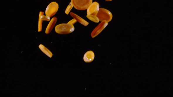 Slices of Carrot Falling in Slowmo