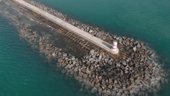 Maritime Lighthouse on Rocky Portugal Coast Pier - Aerial