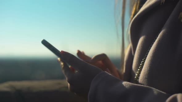 Young Female Scrolling Smartphone on Skydeck, Using Navigation App for Tourists