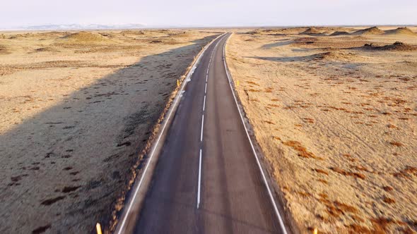 Aerial Over an Empty Highway Running Through a Desert in Iceland