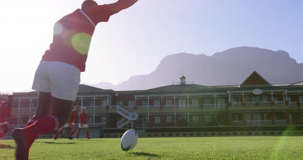 Rugby player kicking the ball from the kicking tee in the stadium 4k