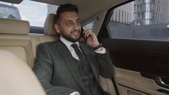Man Having Business Call in Car