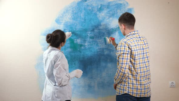 Romantic Couple in Love Draws Painting in Blue and Turquoise