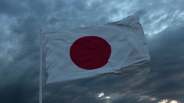 Realistic Flag of Japan Waving in the Wind Against Deep Heavy Stormy Sky