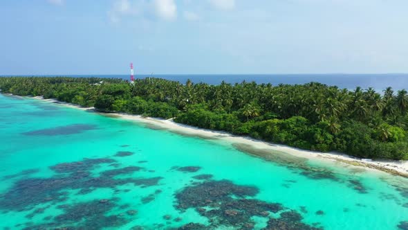 Aerial travel of tranquil bay beach journey by blue green sea with white sand background of a dayout