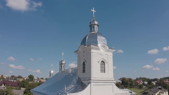 Dome of Church. Aerial View. Traditional Old Church in Ukraine Small Village. Blue Sky Background