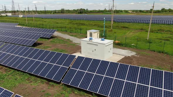 Drone Footage of the Solar Panels Near a Transformer in the Field