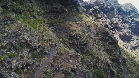 Adventurous Person Hiking Trail In Mountains