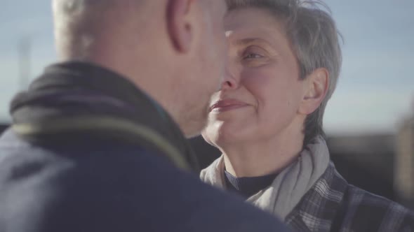 Portrait of Senior Woman Face Close Near Face of Senior Man