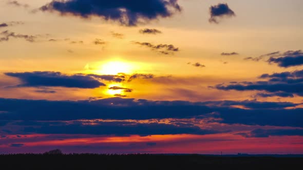 Amazing Sunset Through the Cumulus Clouds in the Orange Sky Majestic Timelapse