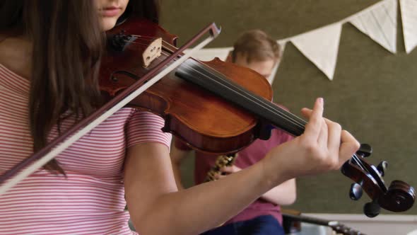 Teenage musicians rehearsing