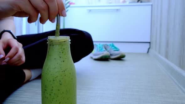 Woman Drinking Seasonal Matcha Green Vegan Smoothie with Chia Seeds and Mint Smoothie Drink Detox