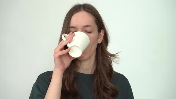 Young Woman with Toothache Drinking Cold Water